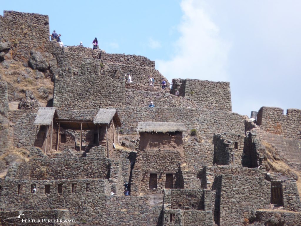 Visitors tour the Inca ruins of Pisac in the Sacred Valley, Cusco - Peru 