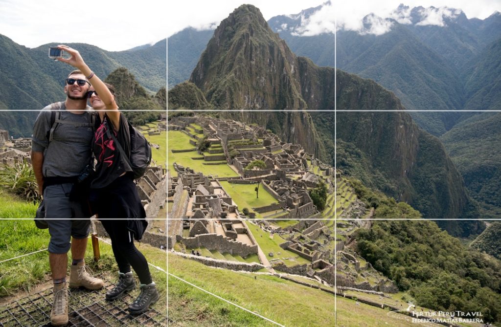 Couple take a selfie at Machu Picchu, with "rule of thirds" grid superimposed to demonstrate the compositional concept. 