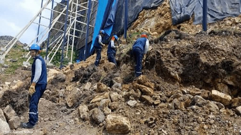 Workers clear debris and rebuild a collapsed portion of the retaining wall of Kuelap, the Chachapoya temple fortress in northern Peru